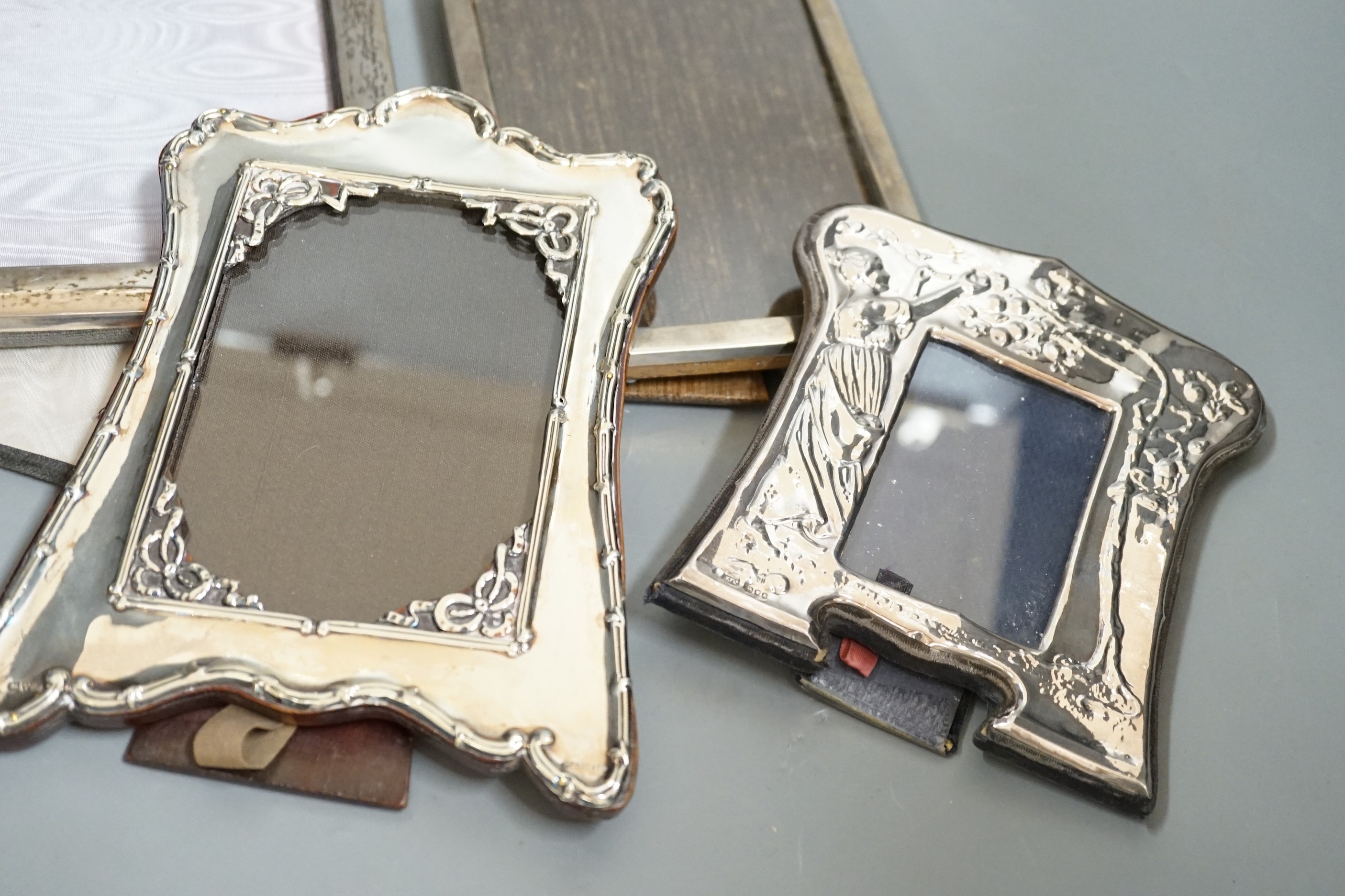 Four assorted silver mounted photograph frames including Edwardian, Chester, 1906, largest 19.9cm.